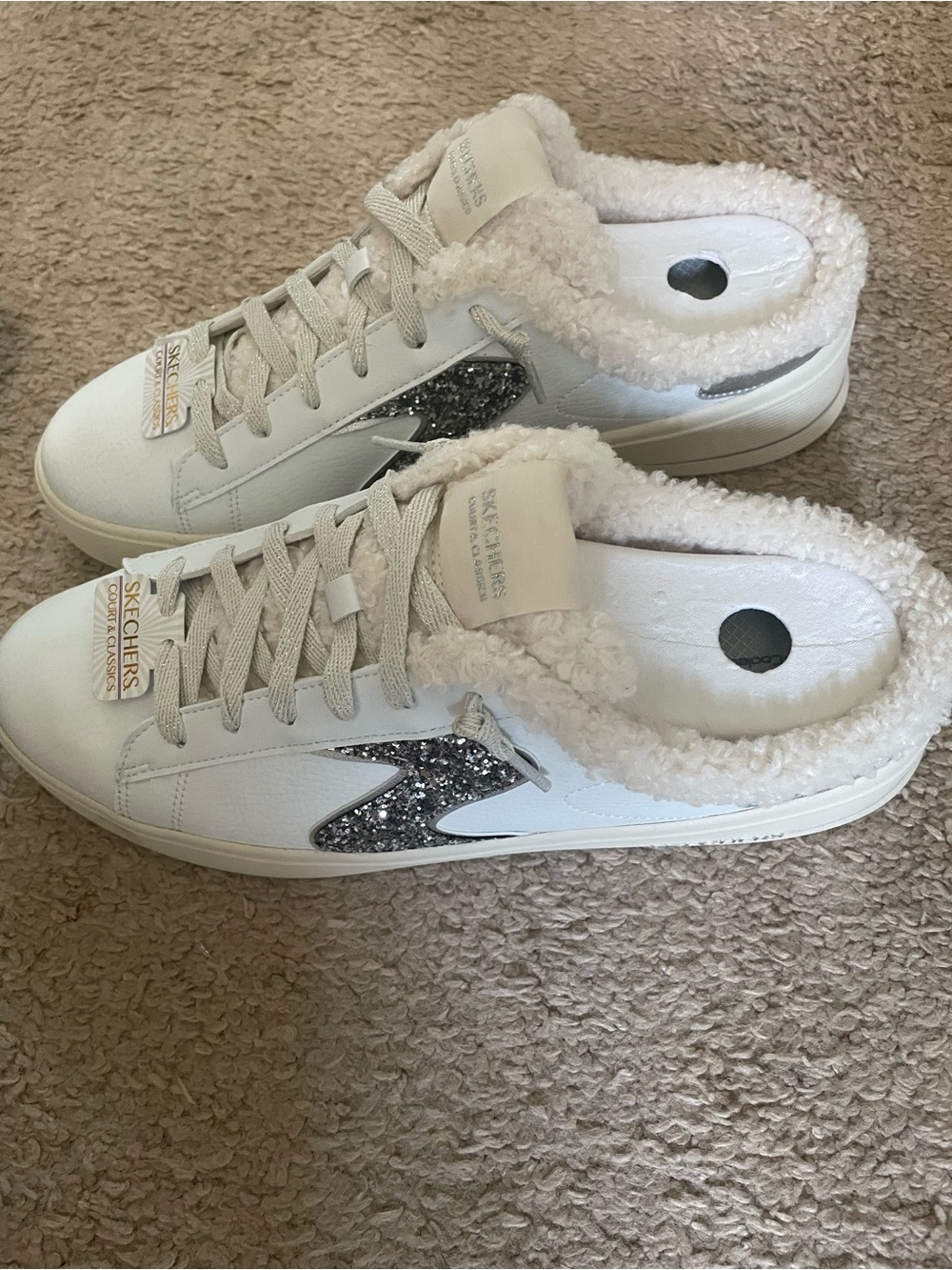 Skechers White Sherpa-Lined Slip-On Sneaker with Silver Glitter Accent. New